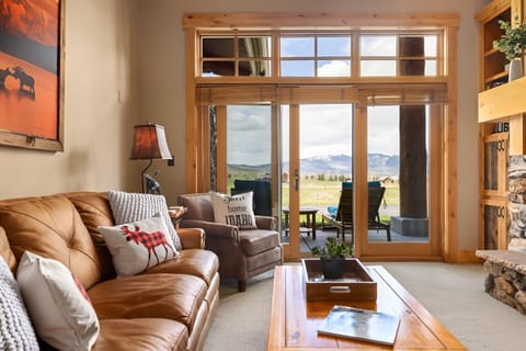 Unwind on plush leather seating with sweeping mountain views.