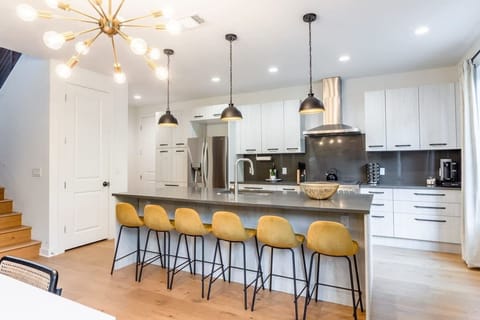 Spacious Kitchen With Island And Bar Seating
