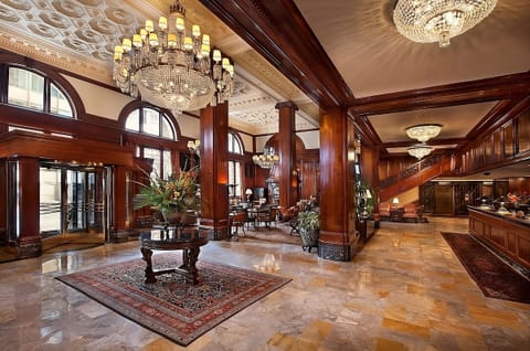 Step into a sparkling lobby with soaring, chandeliered elegance.
