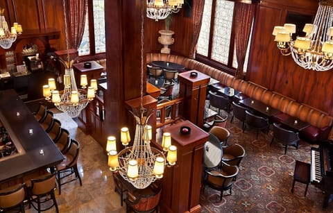 Toast the evening in a richly paneled dining lounge.