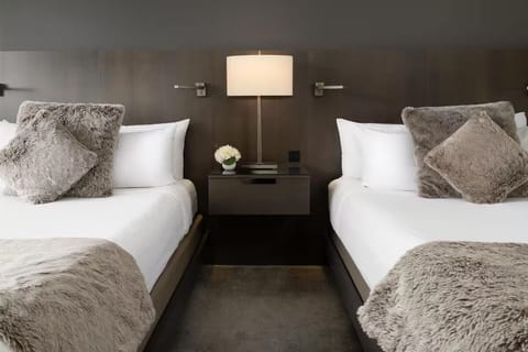 Settle in comfortably with two plush beds and warm lighting.