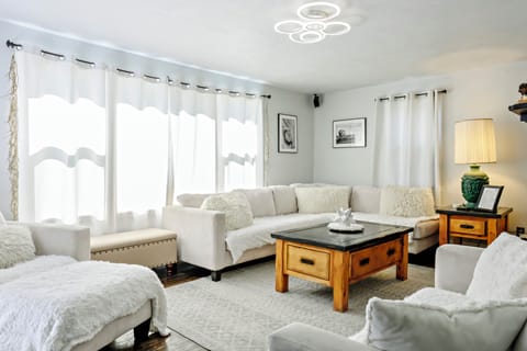 Bright, cozy living room with plush seating and natural light.