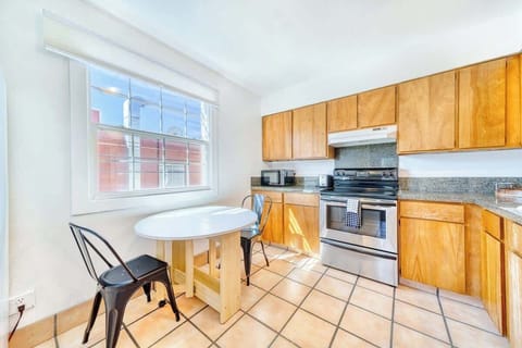 Kitchen with small dining area and plenty of storage 