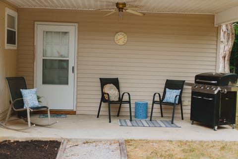 Cook on the back porch with our 4 burner grill, propane tank included.
