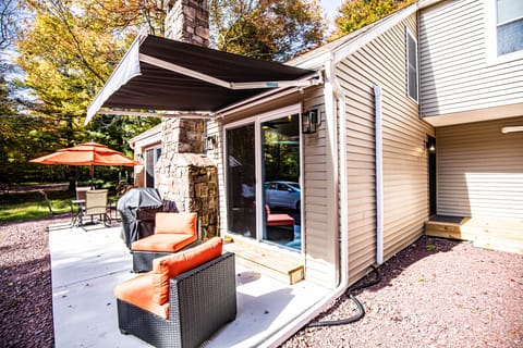 Relax out front at the dining table or pillowed seating area