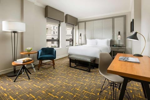 Wake refreshed in a sunlit room designed for easy comfort.