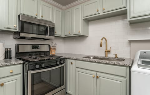 Gas range and stocked kitchen, washer and dryer as well 