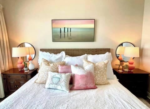 Master bedroom with a comfy King size bed.  This main bedroom has an en-suite bath and balcony access.  