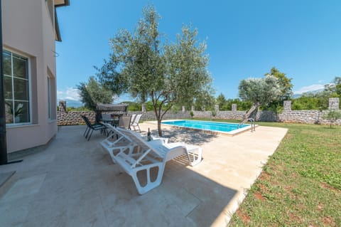 Outdoor pool area. Place where you can relax and enjoy in this beautiful villa.
