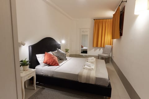 Master bedroom with double bed and AC