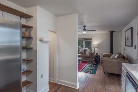 Another view of the kitchen and pantry for storage.
