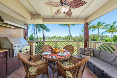 Covered lanai with BBQ and golf course views