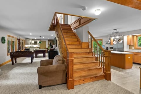 Spacious first floor with pool table, foosball, couches, wet bar, dining room and kitchen!