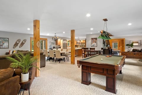 Spacious first floor with pool table, foosball, couches, wet bar, dining room and kitchen!