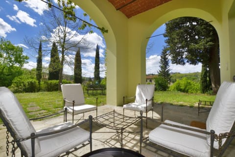 The private exclusive loggia open on the equipped garden