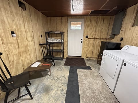 washer and dryer, additional towels, fishing rod holders, and outside door