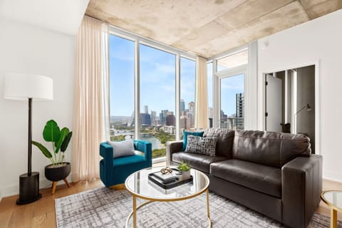 Spacious living area with panoramic view of Downtown Austin and Lady Bird Lake
