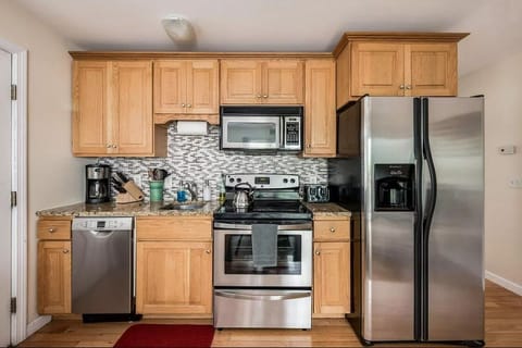 Granite countertops, dishwasher, microwave, coffee pot, toaster, pots and pans
