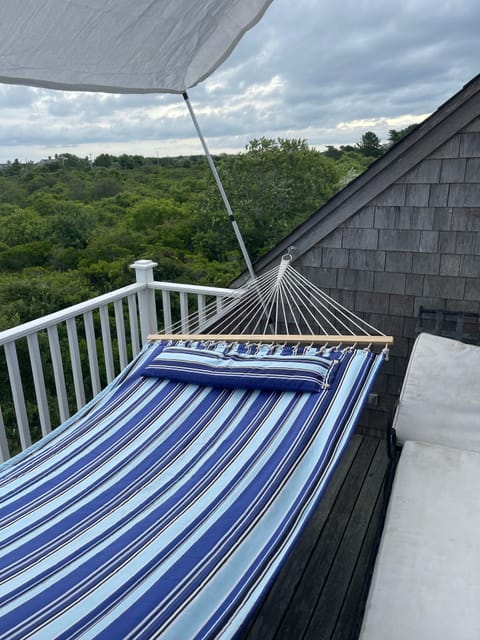 Deck with hammock off second floor guest bedroom