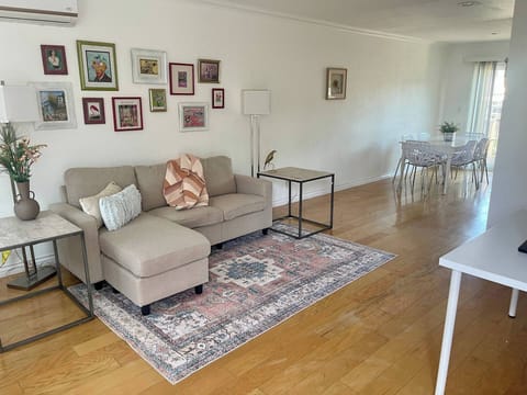Spacious living room with smart TV & A/C