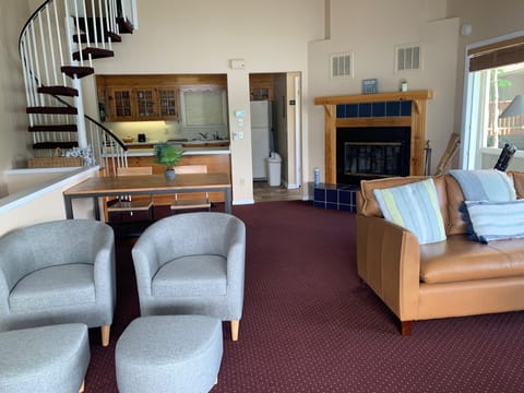 Living Room, sprial stairs to loft, stairs to main and guest room downstairs