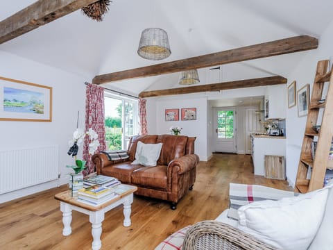 Open plan living space with wood flooring and exposed beams | The Bull Pen, Lawford
