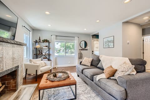 Bright open living room with tons of natural light and 55 inch Roku Smart TV