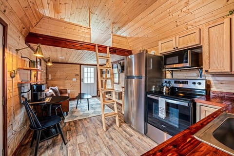 View of kitchen, den and loft access