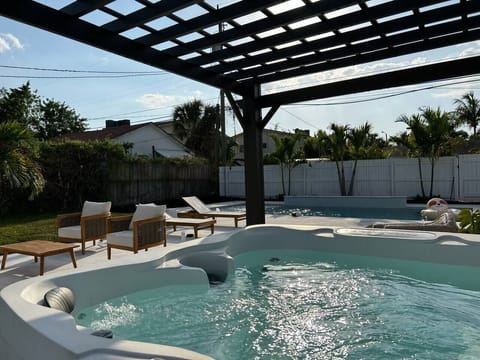 Completed in 2023, our oversized luxury pool comes with fountains, a waterfall and a unique, custom tropical mural on the back of the house. Enjoy this sliver of backyard paradise!