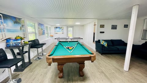 The ultimate fun GAME room!! Pool table, Ping Pong table, TV, cool AC, couches