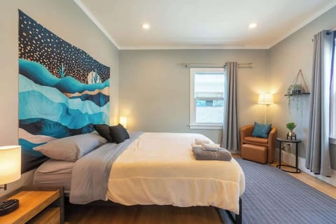 A cozy and restful bedroom with soft lighting and comfortable bedding, perfect for winding down after a long day.