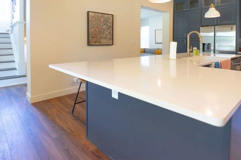 Large kitchen island with Quartz counter tops