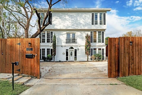Large Privacy fence surrounds the property and allows more than 8 cars to park securely