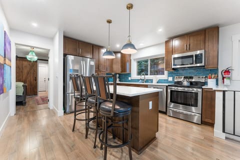 Kitchen with barstool seating at the large counter