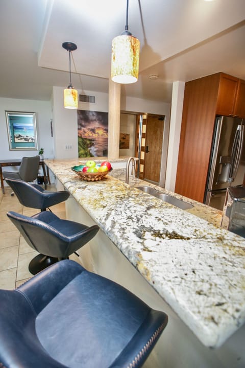 Smooth and shiny granite countertops make this the perfect space for serving!