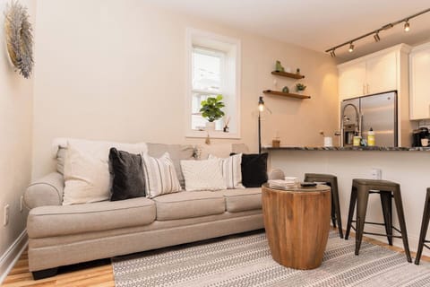 Cozy living room featuring a comfortable couch, perfect for relaxing after a long day.