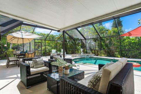 Relax poolside under the awning with a glass of wine with family & friends.  New 55" Smart TV with cable added.