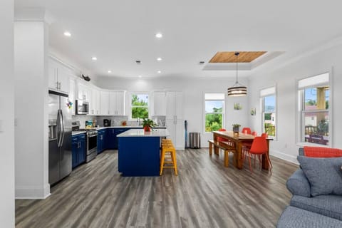 View from the living space into the open kitchen and dining.