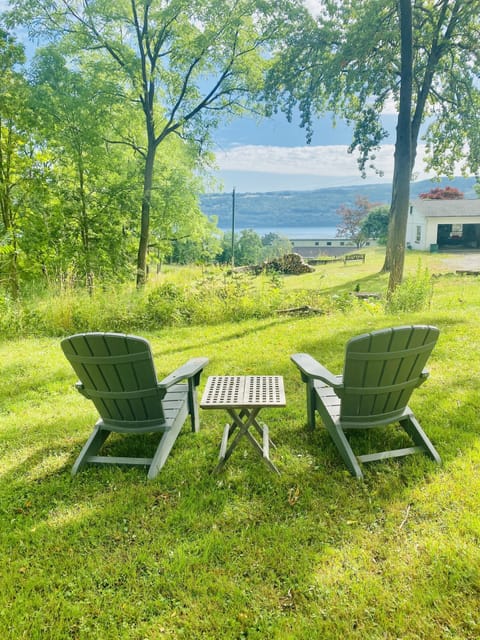 Outside sitting area with fire pit and a view of the lake