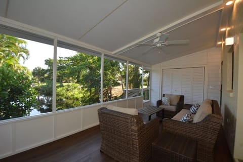 Tranquil lanai with serene canal views.