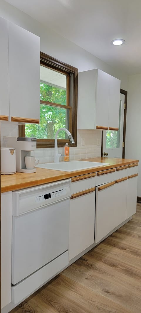 very spacious kitchen with lots of coffee and sweeteners to get your day started