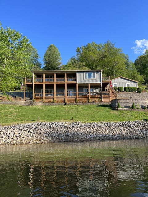 Only a small sloped yard between the house and the water