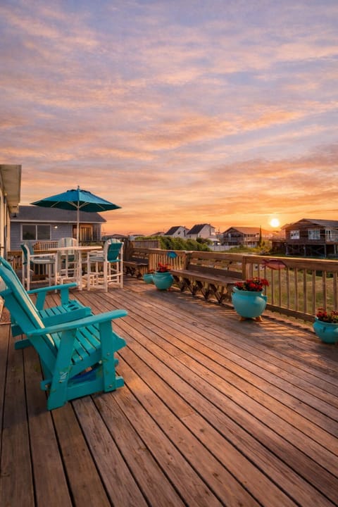 ☀️ Spacious patio with outdoor seating, perfect for relaxing in the coastal breeze.