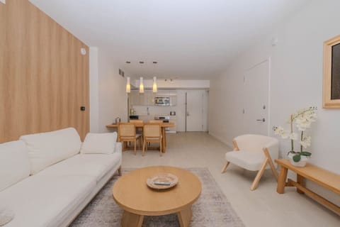 Relax in the modern and spacious living room of this luxurious 2-bedroom apartment at Beachwalk, Hallandale Beach. Perfect for enjoying movie nights on the 50`` Smart TV or simply unwinding after exploring Miami and Fort Lauderdale.