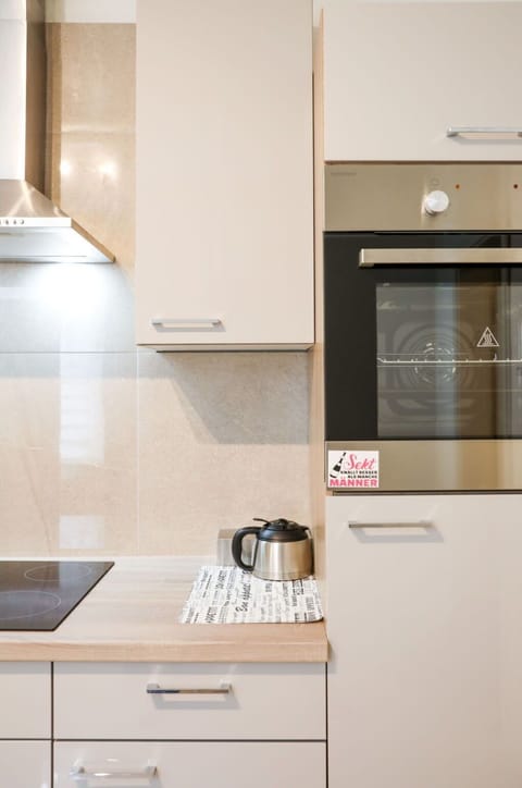 Cabinetry, Countertop, Furniture, Property, Kitchen, Building, Kitchen Appliance, Wood, Kitchen Stove, Flooring