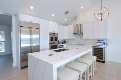 Chef's Kitchen Island with hidden electrical plugs for small kitchen appliances