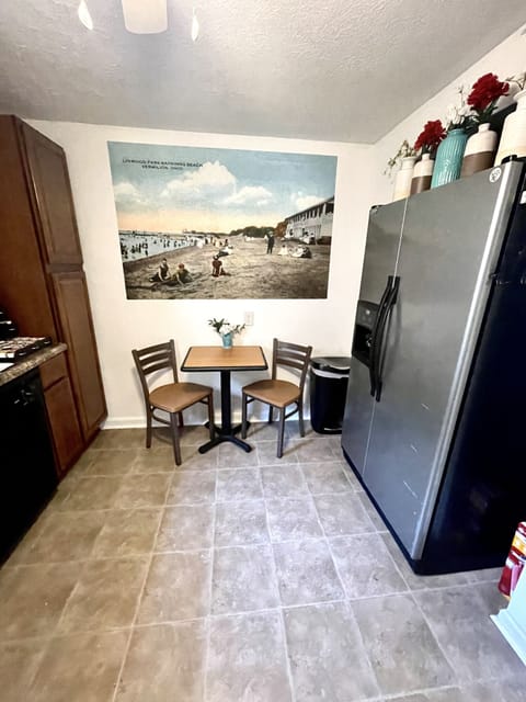 Large kitchen with an additional space to sit and some beautiful Vermilion art!