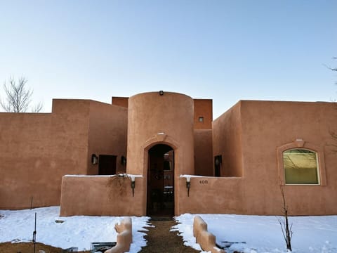 Front of house in the snow.