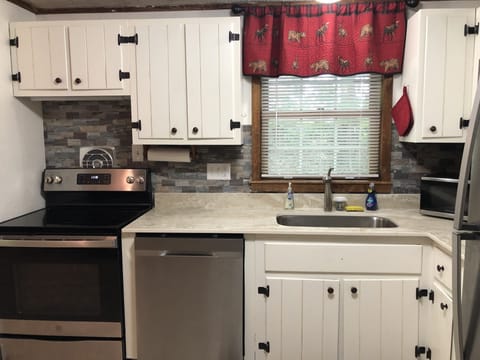 Kitchen - new stove, refrigerator and dishwasher.  New counter & sink/faucet.  
