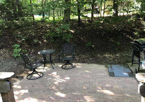 Patio to the right of the deck - with seating and grill to the right